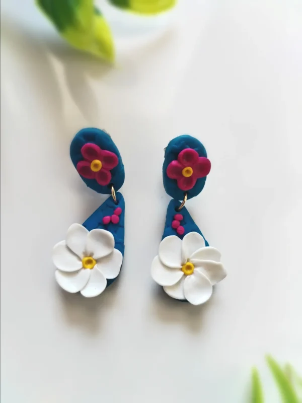 Blue Handcrafted Earrings with White Flower Design